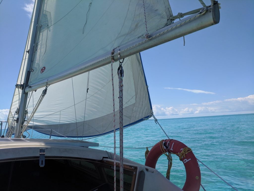 sailing story Bahamas island life water turquoise sailboat sails waves